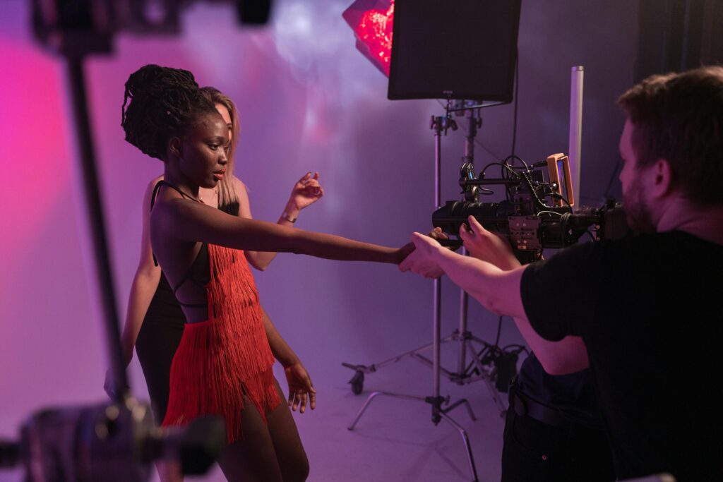 Vibrant studio photoshoot featuring diverse models and photographers working closely together.